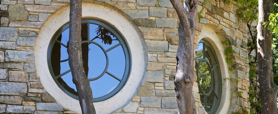 A veneer circle window on the wall of a house