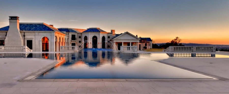 A limestone house with a pool