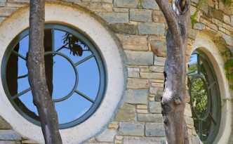 A veneer circle window on the wall of a house