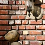 A closeup look of Brick wall with lamp
